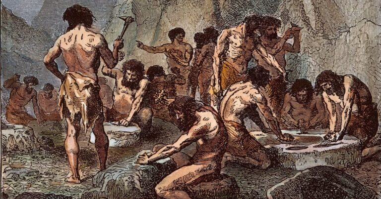 hombre primitivo fabricando herramientas de piedra